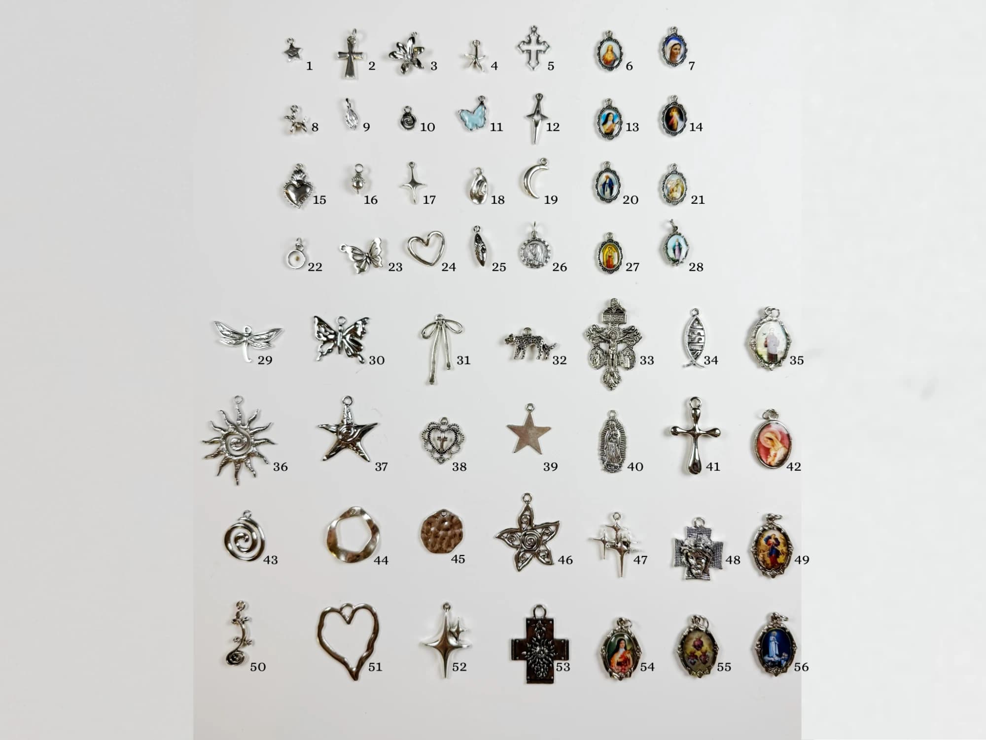 Fatima's silver charms, each one numbered