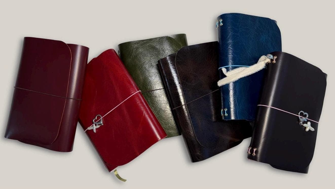 Six devotional companions in burgundy, red, olive, espresso, navy and black leather